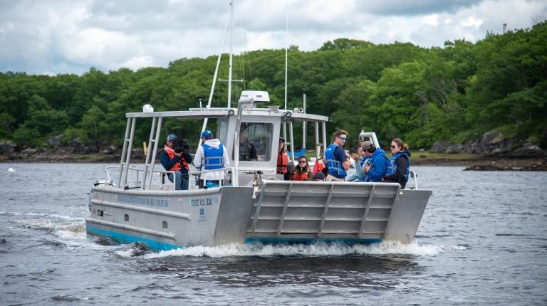 Students and researchers depart from campus on the research boat